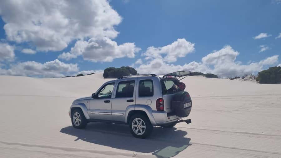 Cape Town: Sand Dunes 4x4 Sandboarding Tour - Getting set up with the sandboard