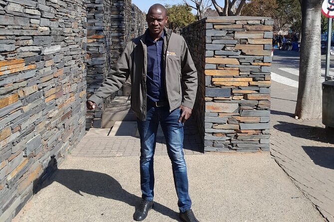 Half Day Soweto and Apartheid Museum Guided Tour - Walking through Motsoaledi informal settlement