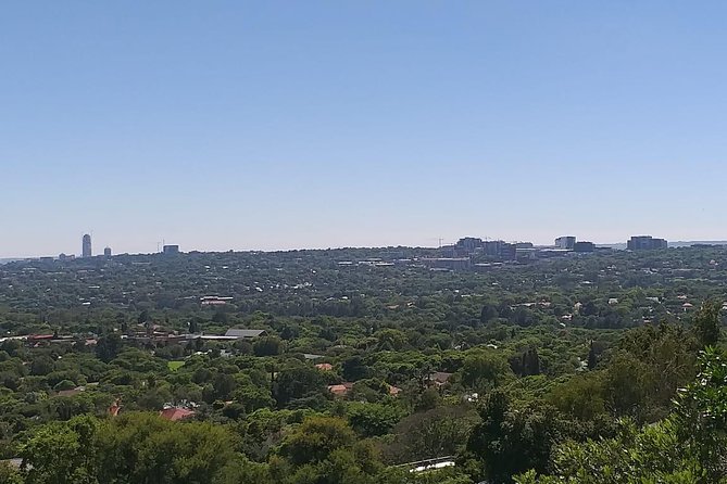 Soweto and Johannesburg Exclusive Full Day Guided Tour - Diepkloof Park and Orlando Towers show Soweto in two frames